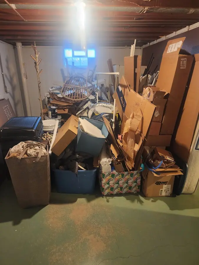 Roll-off dumpster container at job site for 2 Yard Dumpster Rental in Richmond Hill