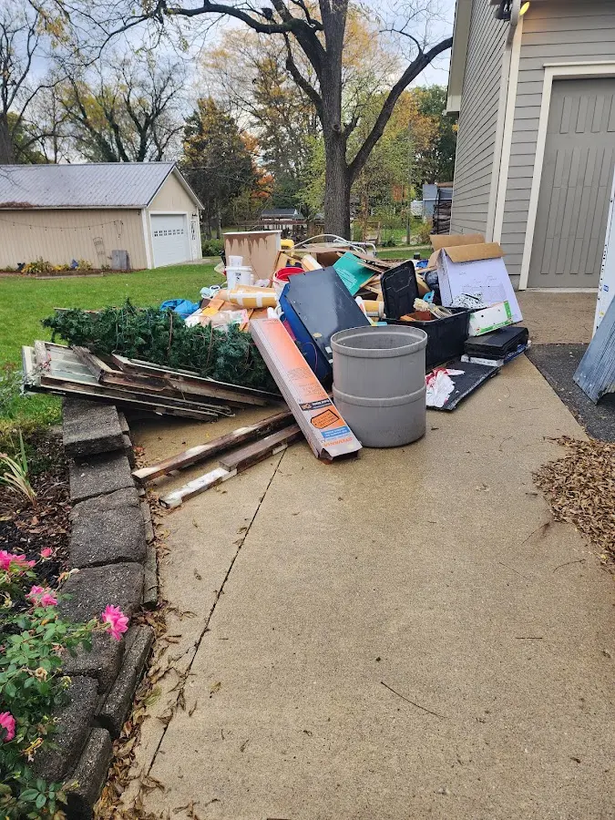 Dumpster being loaded with debris for Roofing Dumpster Rental in Richmond Hill